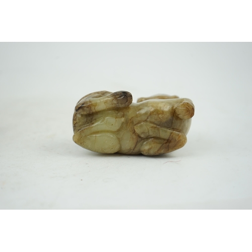 234 - A Chinese celadon and mottled brown jade figure of a monkey climbing on a recumbent horse, Ming dyna... 