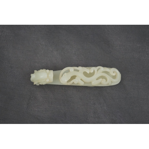 235 - A Chinese white jade dragon belt hook, 18th/19th century, the stone of excellent even tone, carved... 