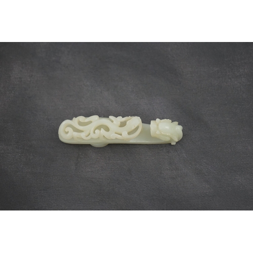 235 - A Chinese white jade dragon belt hook, 18th/19th century, the stone of excellent even tone, carved... 