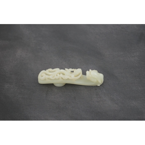 235 - A Chinese white jade dragon belt hook, 18th/19th century, the stone of excellent even tone, carved... 