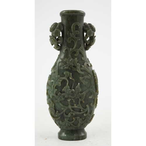 255 - A Chinese spinach green jade arrow vase, hu, 18th/19th century, of flattened bottle shape, crisply c... 