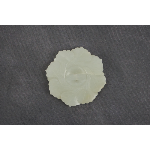 256 - A Chinese pale celadon jade mallow flower plaque, 18th/19th century, the tips of the petals carved... 