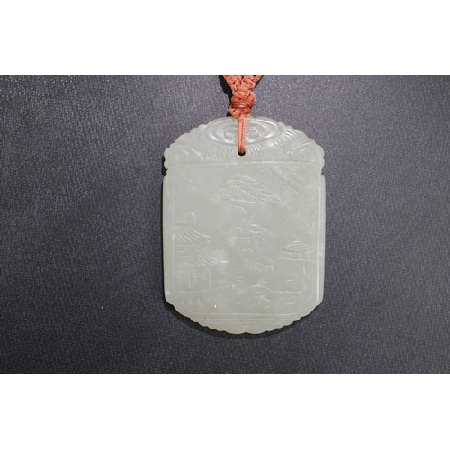 261 - An unusual Chinese pale celadon jade plaque, 19th century, carved to each side with the same scene o... 