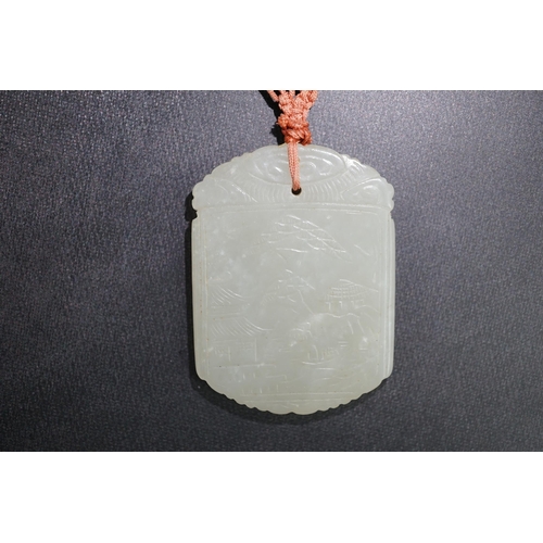 261 - An unusual Chinese pale celadon jade plaque, 19th century, carved to each side with the same scene o... 