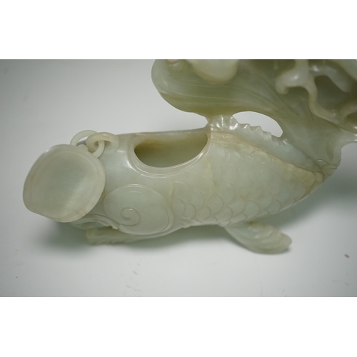 264 - A large Chinese pale celadon jade dragon-fish vessel and cover, 19th century, with a small chain-l... 