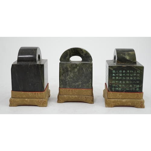 268 - A set of three Chinese inscribed soapstone literati seals, two of square section and one of slender ... 