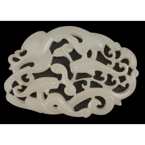 269 - A Chinese white jade reticulated chilong plaque, the stone of good even tone, 6cm wide