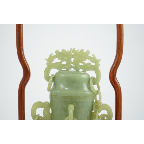 271 - A Chinese green jade vase and cover, 20th century, carved in archaistic style with pierced scrollwor... 