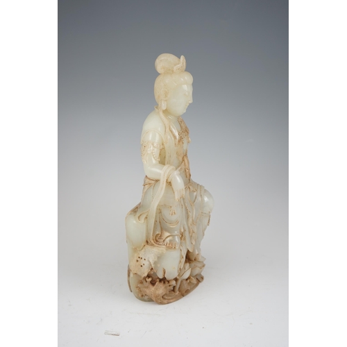 273 - An impressive Chinese white and calcified jade figure of a Bodhisattva, 20th century, the figure fin... 