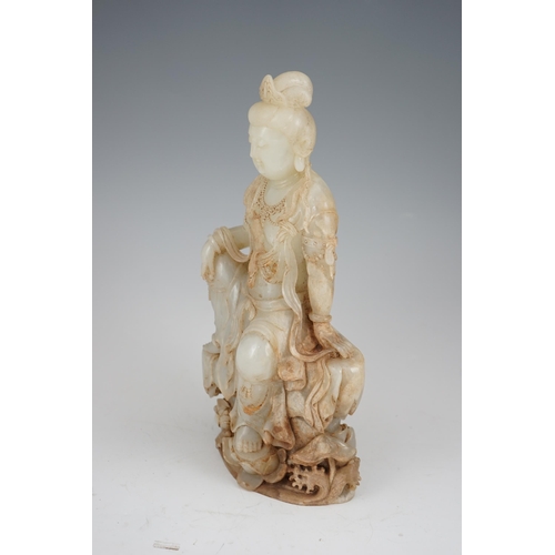 273 - An impressive Chinese white and calcified jade figure of a Bodhisattva, 20th century, the figure fin... 