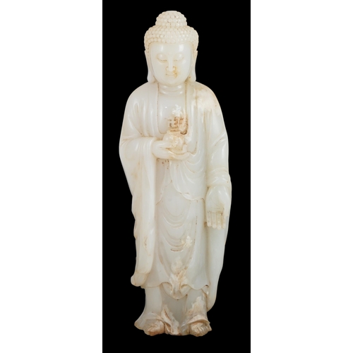 275 - A massive Chinese white and calcified jade standing figure of Buddha Shakyamuni, in Tang style, but ... 