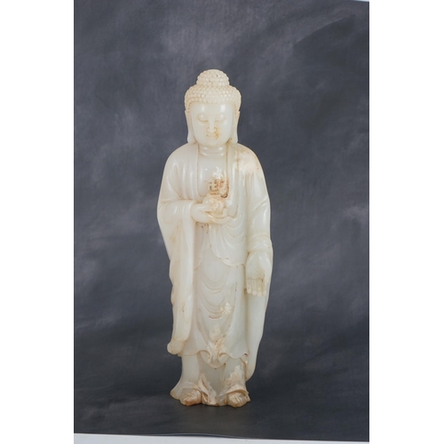 275 - A massive Chinese white and calcified jade standing figure of Buddha Shakyamuni, in Tang style, but ... 