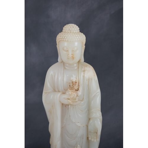 275 - A massive Chinese white and calcified jade standing figure of Buddha Shakyamuni, in Tang style, but ... 