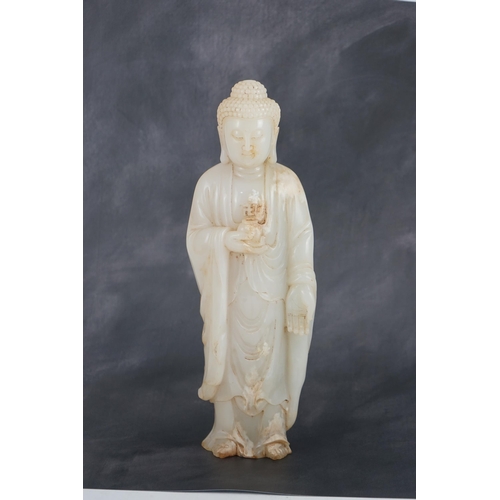 275 - A massive Chinese white and calcified jade standing figure of Buddha Shakyamuni, in Tang style, but ... 