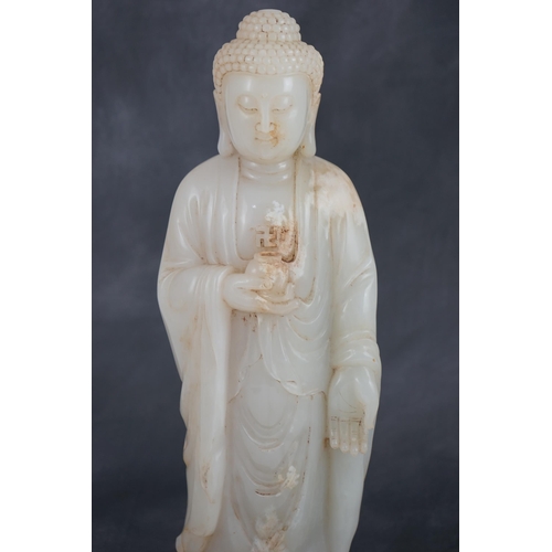 275 - A massive Chinese white and calcified jade standing figure of Buddha Shakyamuni, in Tang style, but ... 