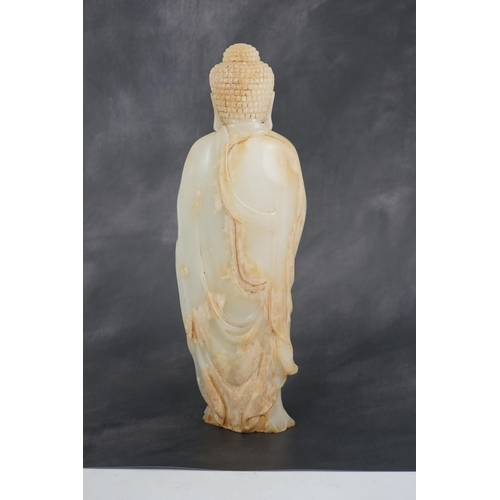 275 - A massive Chinese white and calcified jade standing figure of Buddha Shakyamuni, in Tang style, but ... 