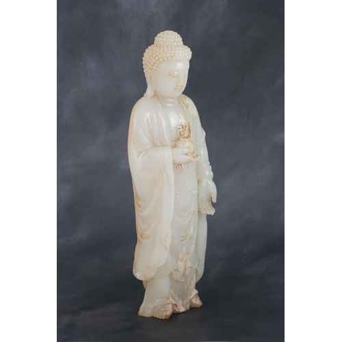 275 - A massive Chinese white and calcified jade standing figure of Buddha Shakyamuni, in Tang style, but ... 