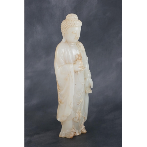 275 - A massive Chinese white and calcified jade standing figure of Buddha Shakyamuni, in Tang style, but ... 