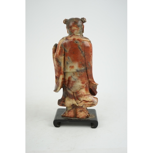 277 - A Chinese soapstone figure of the immortal Han Zhongli holding a fan, 18th century, his robes finely... 