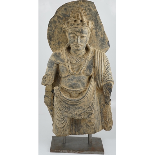 281 - A large grey schist Bodhisattva figure, Gandhara, 2nd/3rd century A.D., dressed in a flowing sangha... 