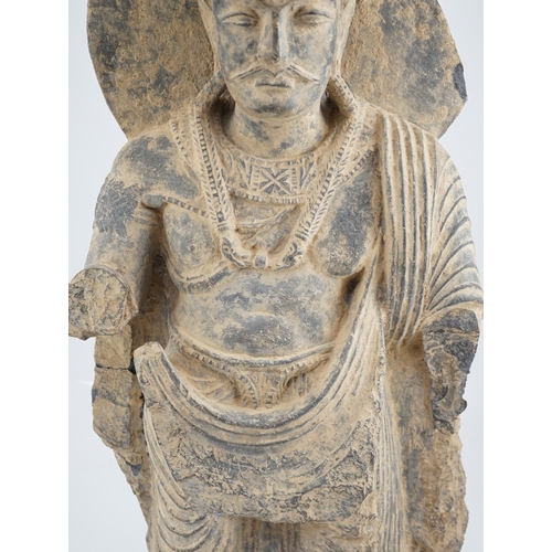 281 - A large grey schist Bodhisattva figure, Gandhara, 2nd/3rd century A.D., dressed in a flowing sangha... 