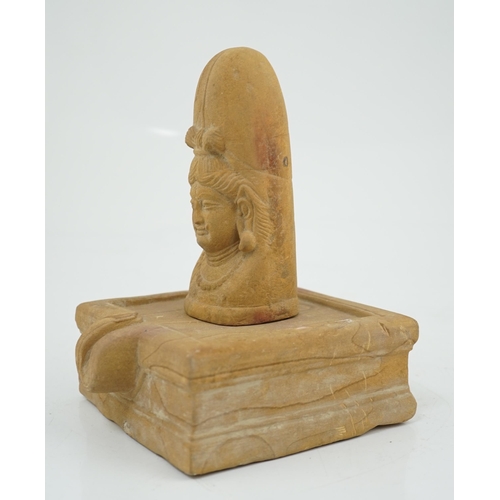 285 - A sandstone Ekamukha Shiva Linga and Yoni, Northwest India, 7th/8th century A.D., the Linga with the... 