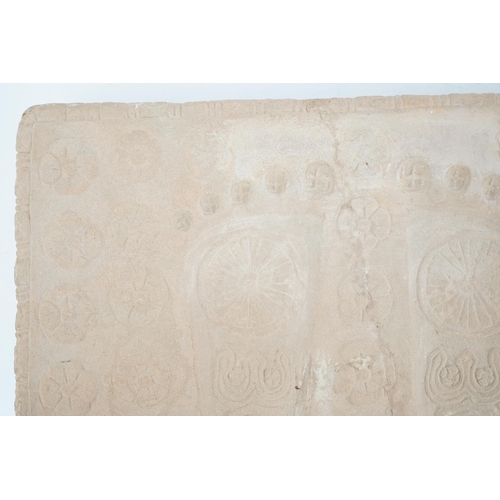 286 - A sandstone relief of Buddhas foot prints (Buddhapada), Southern India, 12th century, 37cmProvenanc... 