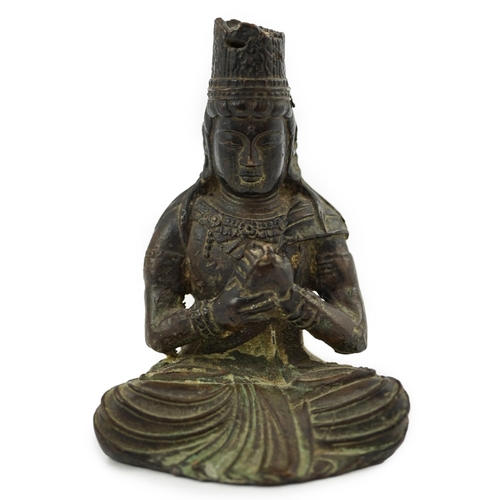 287 - A small South East Asian bronze seated figure of Vairocana Buddha, probably 17th/18th century, 9.5cm... 