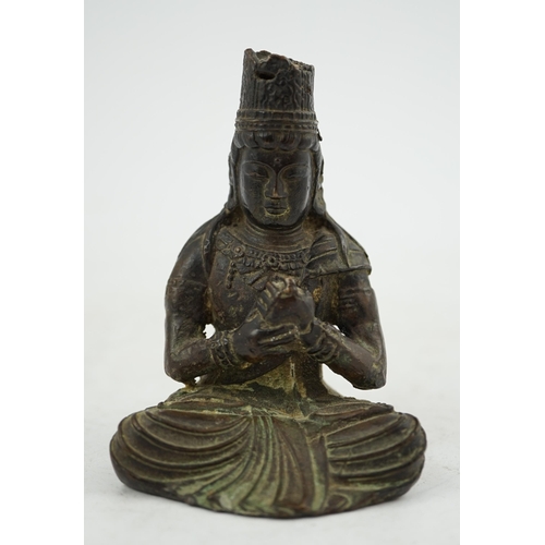 287 - A small South East Asian bronze seated figure of Vairocana Buddha, probably 17th/18th century, 9.5cm... 