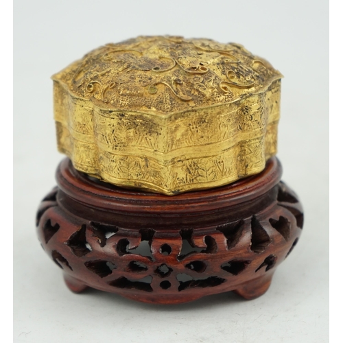 289 - A Chinese gilt metal repoussé work box and cover, Liao dynasty style, of petal lobed form, decorated... 