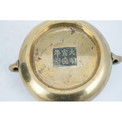 291 - A Chinese bronze censer, gui, Xuande mark, 18th/19th century, the bombé shaped body with a pair of l... 