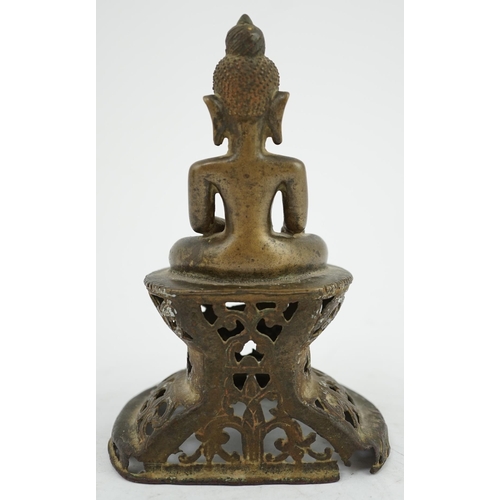 295 - An unusual Burmese bronze seated figure of Buddha, 17th/18th century, his head with unusual spiral g... 