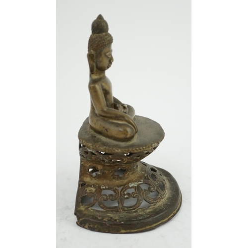 295 - An unusual Burmese bronze seated figure of Buddha, 17th/18th century, his head with unusual spiral g... 