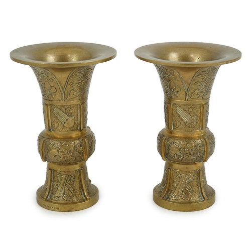 297 - A pair of Chinese bronze beaker vases, gu, 18th/19th century, each cast and chased with butterflies ... 