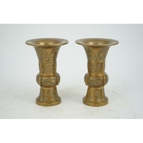 297 - A pair of Chinese bronze beaker vases, gu, 18th/19th century, each cast and chased with butterflies ... 