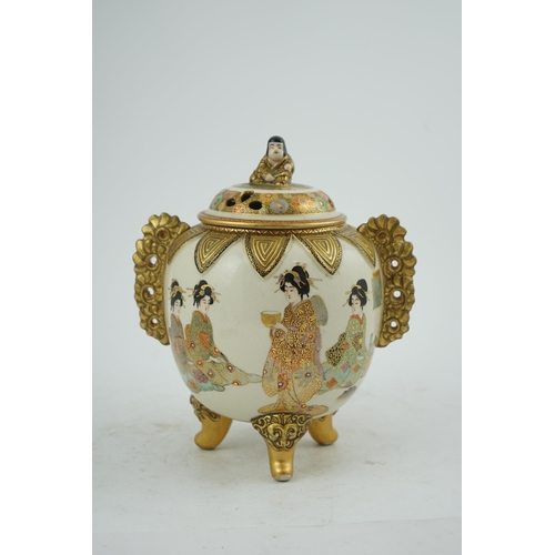 30 - the globular body applied with a pair of pierced gilt floral handles, the pierced domed cover surmou... 