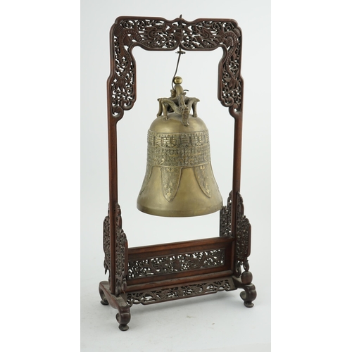 300 - A Chinese archaistic bronze temple bell, and reticulated hardwood stand, Qing dynasty, the polished ... 