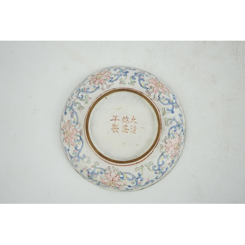 305 - A Chinese Guangzhou enamel saucer dish, 19th century, delicately painted in pastel tones with two la... 