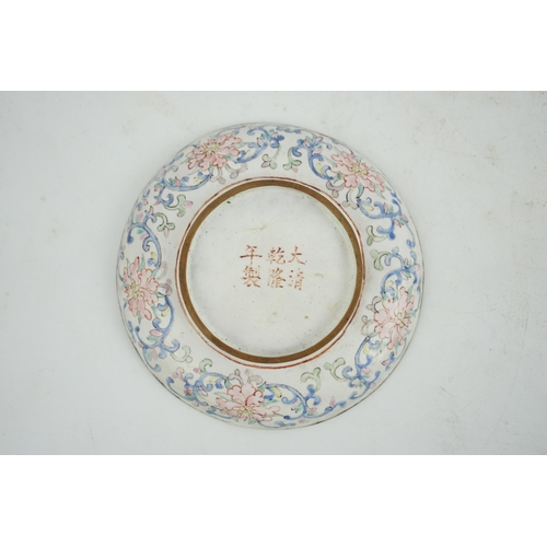 305 - A Chinese Guangzhou enamel saucer dish, 19th century, delicately painted in pastel tones with two la... 