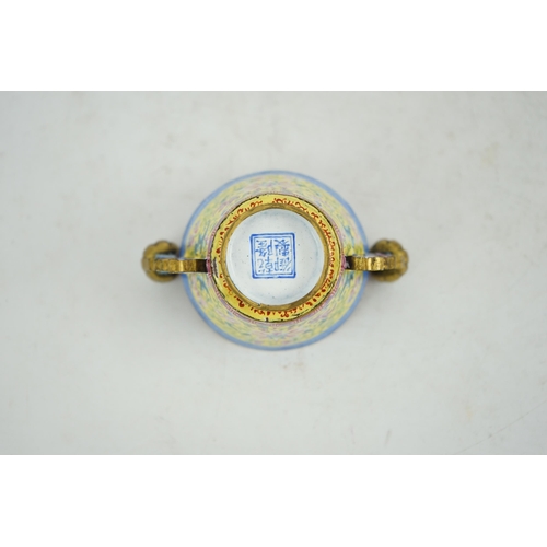 306 - A Chinese Guangzhou enamel two handled wine cup, four character Qianlong mark and of the period (173... 