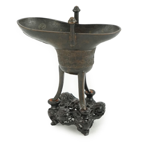 307 - A good Chinese archaistic bronze tripod wine cup, jue, dated Qianlong 3rd year, corresponding to 173... 