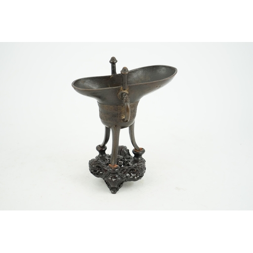 307 - A good Chinese archaistic bronze tripod wine cup, jue, dated Qianlong 3rd year, corresponding to 173... 