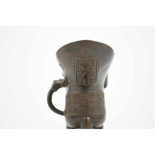 307 - A good Chinese archaistic bronze tripod wine cup, jue, dated Qianlong 3rd year, corresponding to 173... 