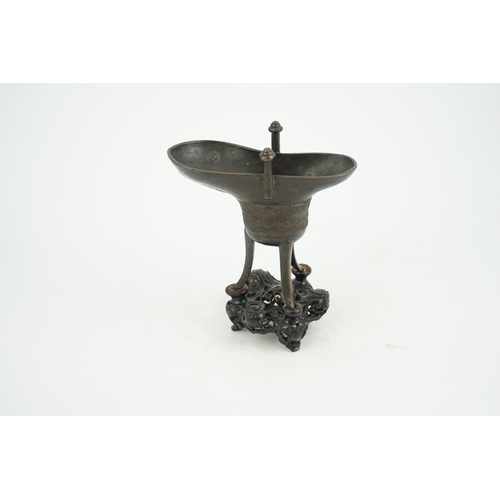 307 - A good Chinese archaistic bronze tripod wine cup, jue, dated Qianlong 3rd year, corresponding to 173... 