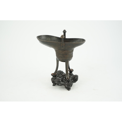 307 - A good Chinese archaistic bronze tripod wine cup, jue, dated Qianlong 3rd year, corresponding to 173... 