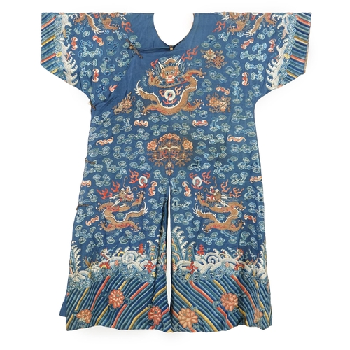 335 - A Chinese blue silk dragon robe, jifu, late 19th century and a mandarin hat, the robe woven with n... 