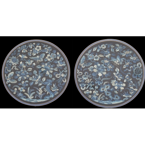 337 - A pair of Chinese embroidered silk roundels, mid 19th century, woven in white and shades of blue wit... 