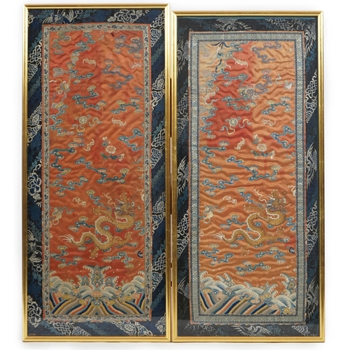 339 - A pair of Chinese coral silk dragon panels, 19th century, worked in polychrome silk and gold threa... 