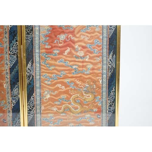 339 - A pair of Chinese coral silk dragon panels, 19th century, worked in polychrome silk and gold threa... 