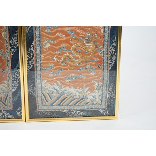 339 - A pair of Chinese coral silk dragon panels, 19th century, worked in polychrome silk and gold threa... 